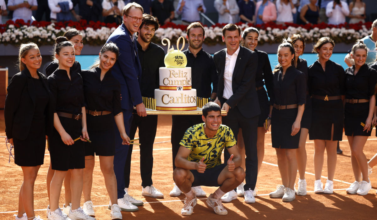 Spain's Carlos Alcaraz poses alongside a birthday cake after winning his semifinal match against Croatia's Borna Coric on Friday. (Reuters)