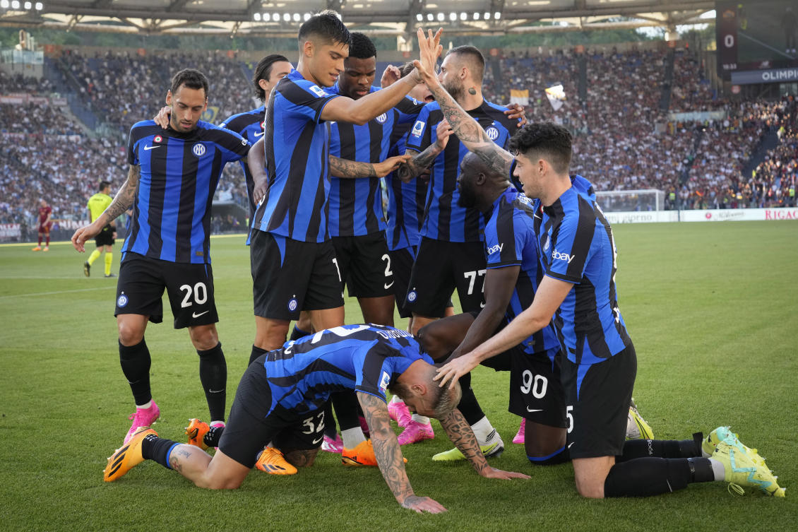 Inter Milan players celebrate after Federico Dimarco scored his side’s opening goal during their Serie A match against Roma at Rome’s Olympic Stadium, on May 6, 2023. (AP)