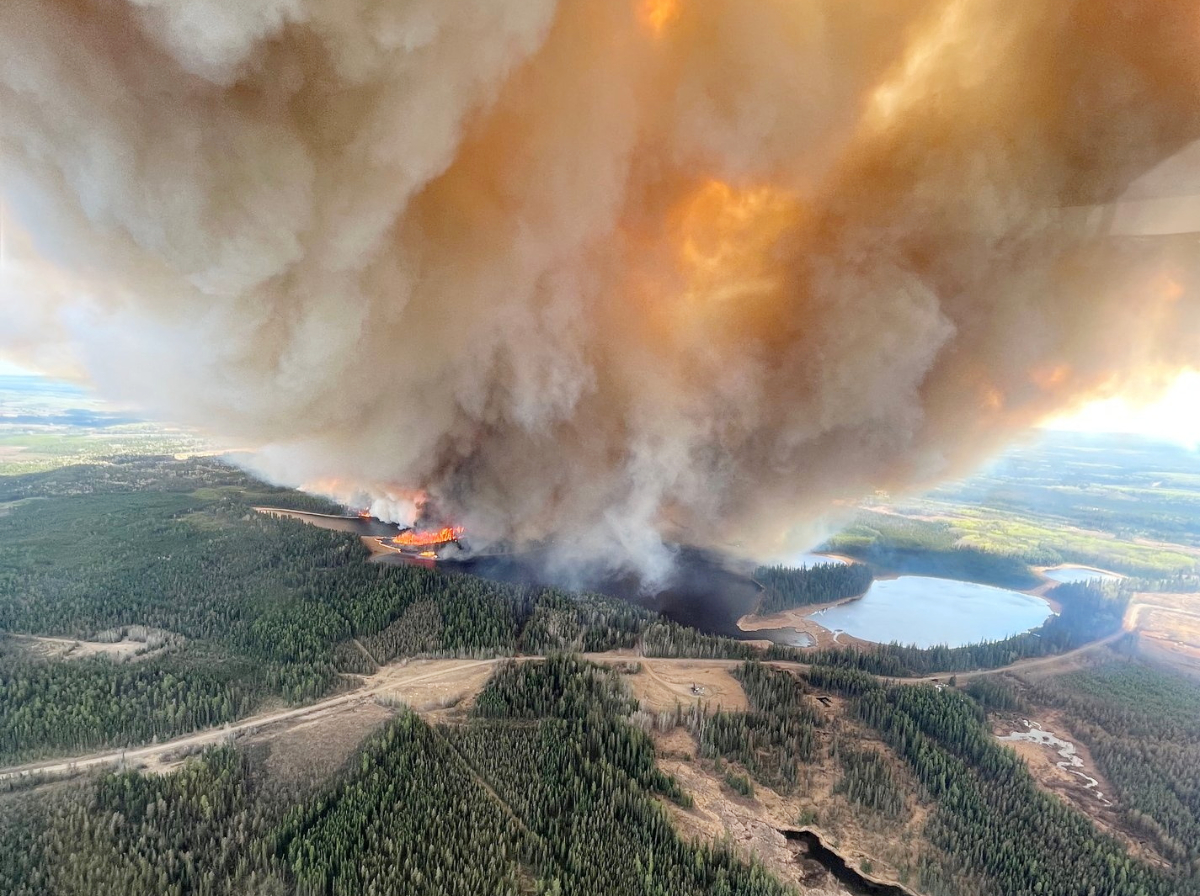 A smoke column rises from wildfire EWF031 near Lodgepole, Alberta, Canada May 4, 2023. (REUTERS)