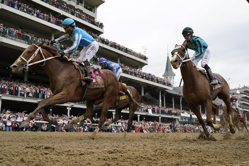 Javier Castellano celebrates after riding Mage to victory at the 149th running of the Kentucky Derby horse race at Churchill Downs Saturday in Louisville, Ky. (AP)