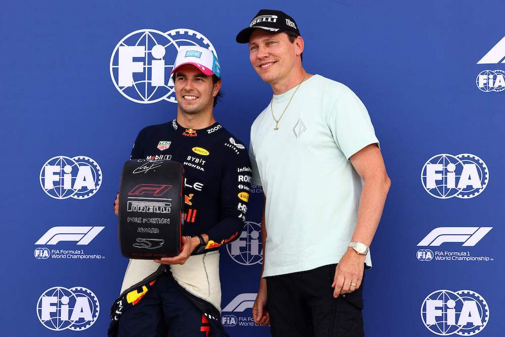 Pole position qualifier Sergio Perez of Mexico and Oracle Red Bull Racing is presented with the Pirelli Pole Position award by Tiesto in parc ferme during qualifying ahead of the F1 Grand Prix of Miami at Miami International Autodrome on Saturday. (AFP)