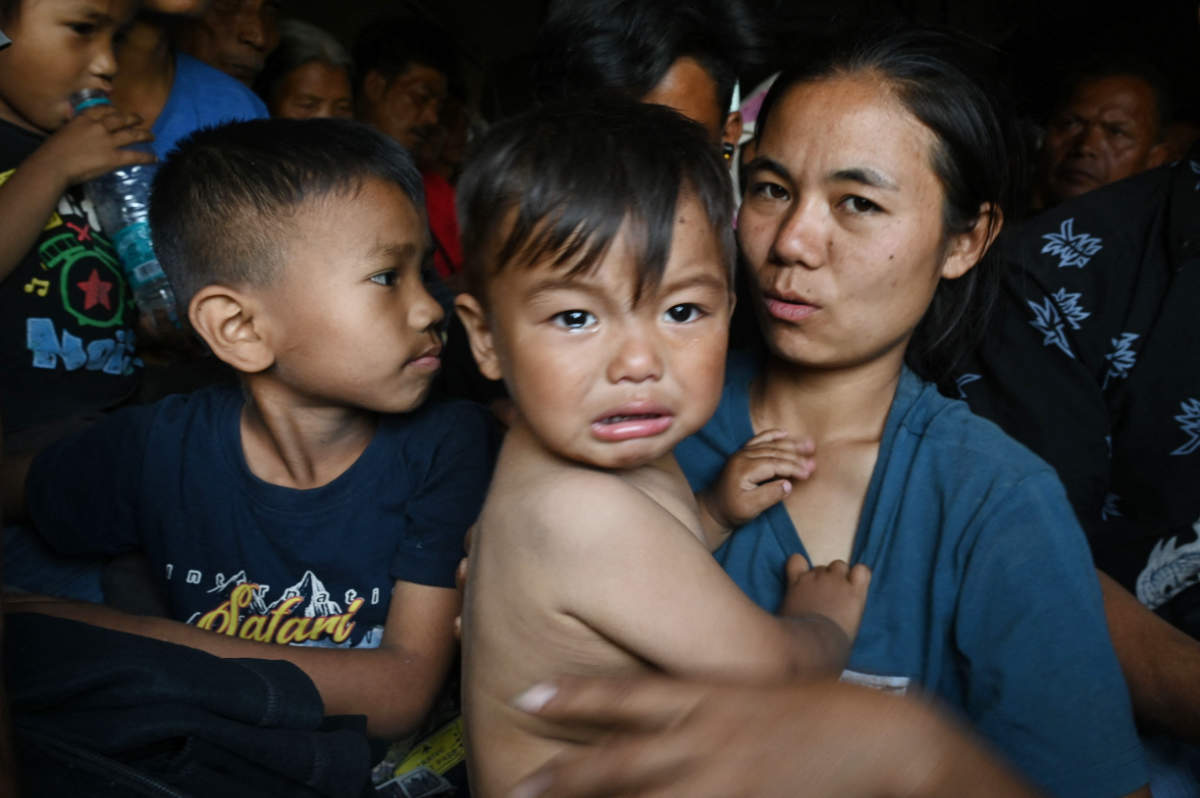 People are evacuated by the Indian army to a temporary shelter as they flee ethnic violence that has hit the northeastern Indian state of Manipur, near Imphal on May 7, 2023. (AFP)