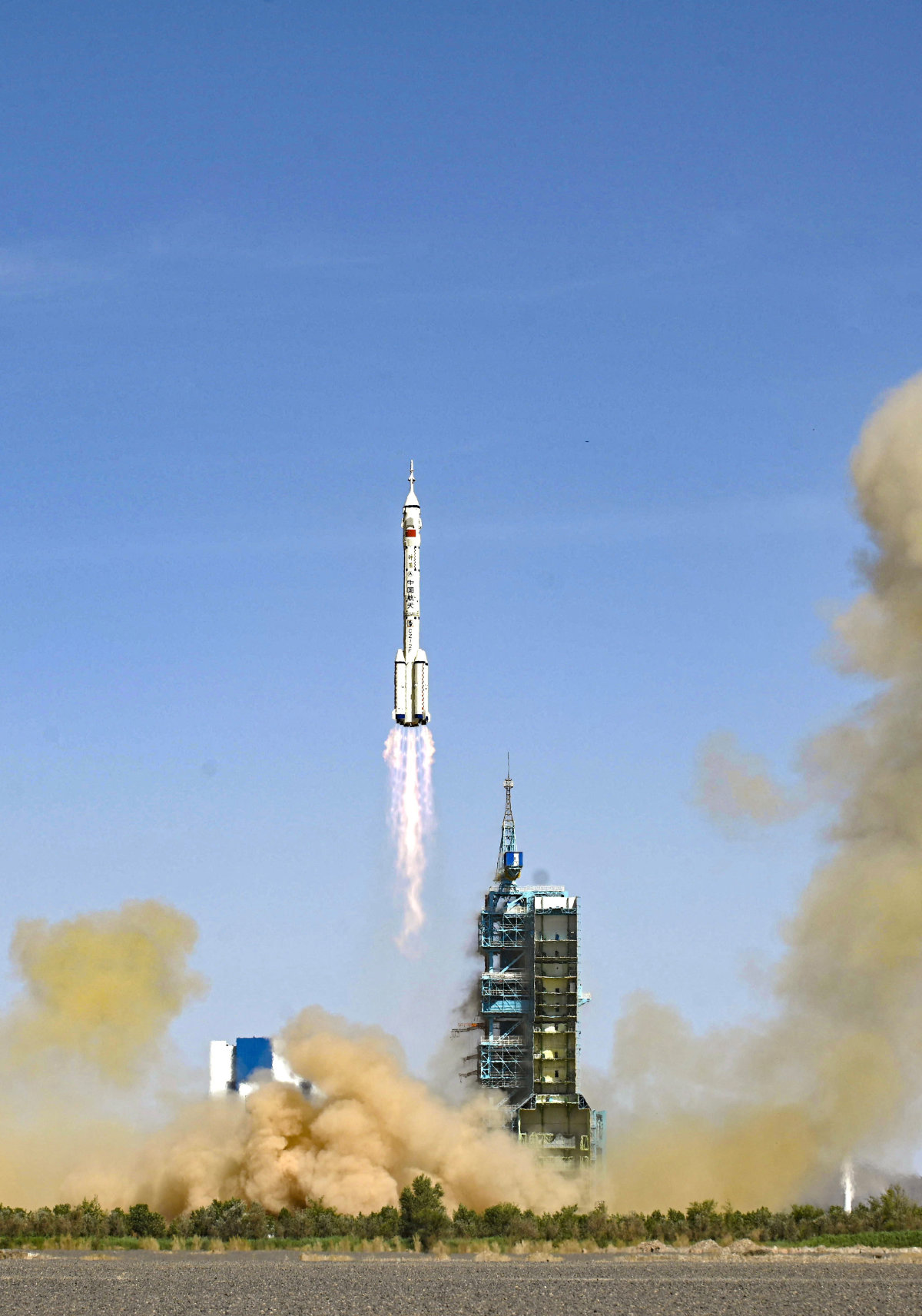 In this June 5, 2022, a rocket lifts off at China's Jiuquan Satellite Launch Center in Gansu province. On Monday, an experimental spacecraft returned to the center after staying in orbit for 276 days. (AFP)