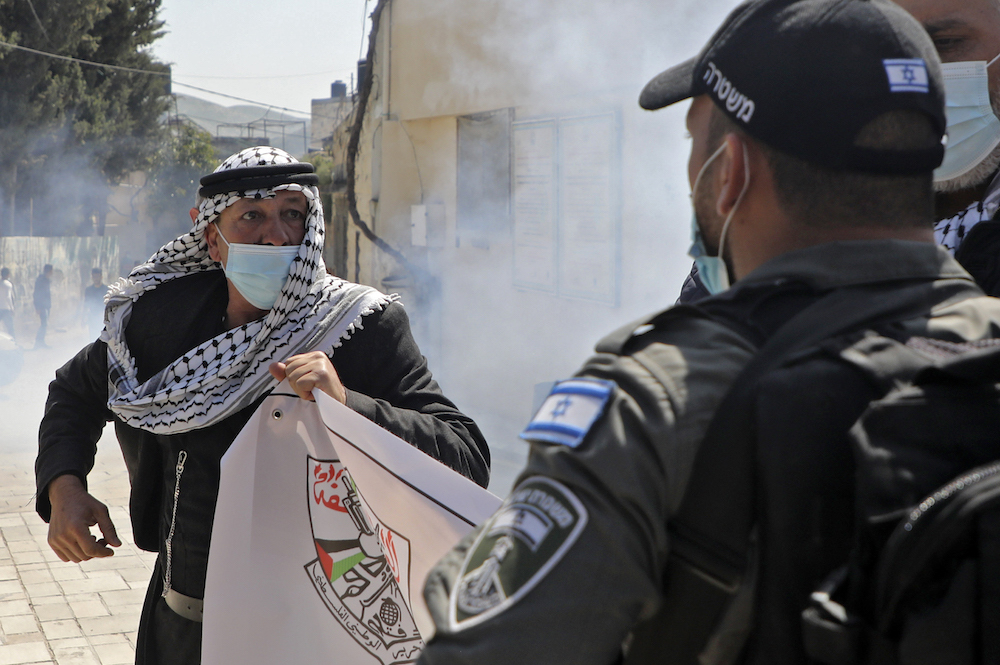 A Palestinian demonstrator rallies against settlers' visit to historical sites in the Palestinian village of Sebastia, Nablus. (File/AFP)