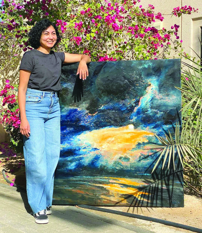 In this picture, posted on May 9, 2021, Bangladeshi Dutch artist Naima Karim gestures with her artwork. (Photo courtesy: Instagram/naimakarim_)