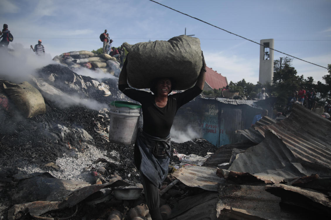 A vendor salvages items from the burned ruins of the Chada Market in the Petion-ville area of Port-au-Prince, Haiti, Thursday, May 4, 2023. (AP)