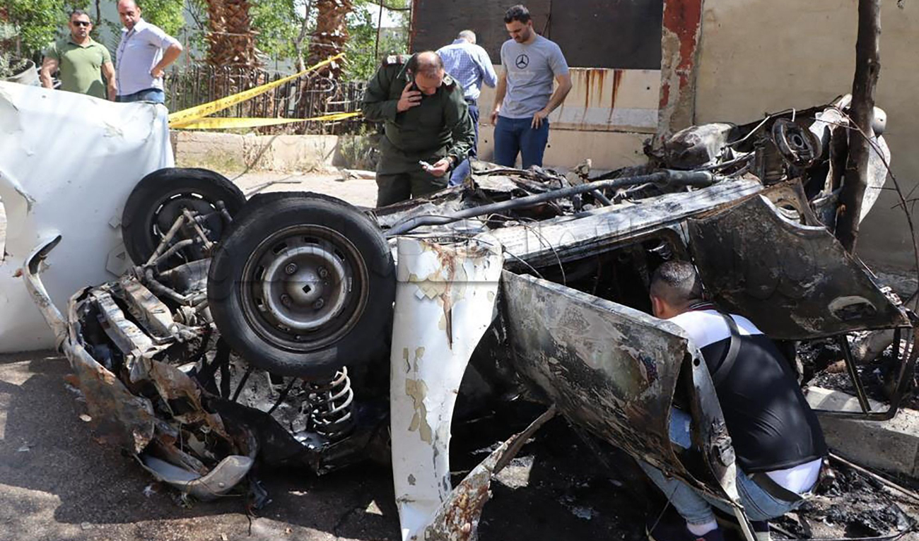 Syrian investigators checking the site of an explosion in Damascus Barzeh neighbourhood on May 10, 2023. (AFP)