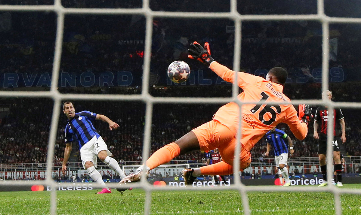 Inter Milan's Henrikh Mkhitaryan scores their second goal past AC Milan's Mike Maignan during their Champions League semifinal first leg match at San Siro, Milan, on Wednesday. (Reuters)