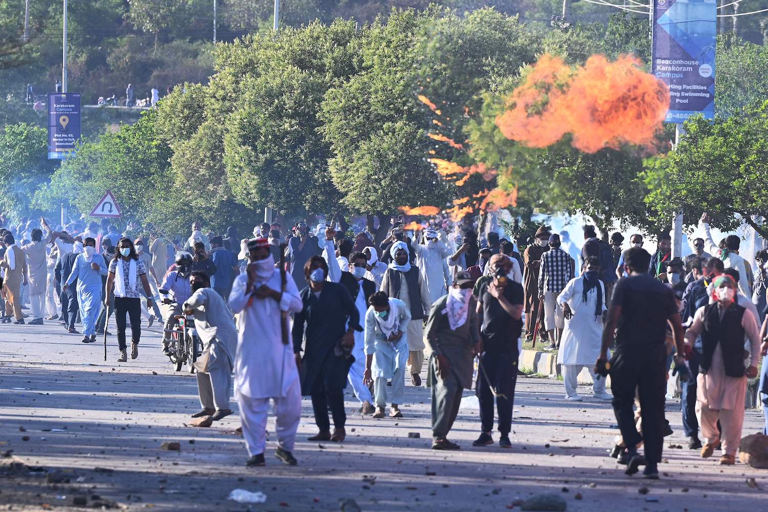 PTI party activists and supporters of former Pakistan’s Prime Minister Imran clash police during a protest outside the police headquarter where Khan is in custody, in Islamabad on May 10, 2023. (AFP)