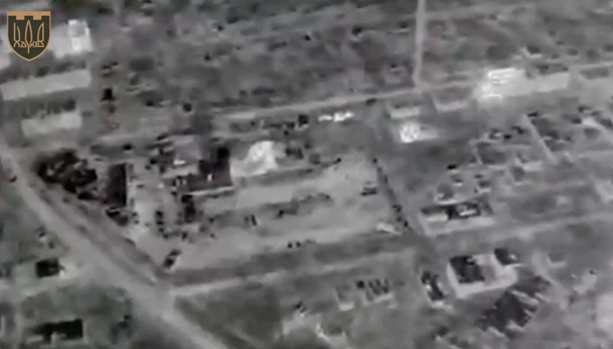A drone view with night vision shows explosion of a building in Bakhmut, Ukraine on May 11, 2023. (127 Separate Territorial Defense Brigade via Reuters)