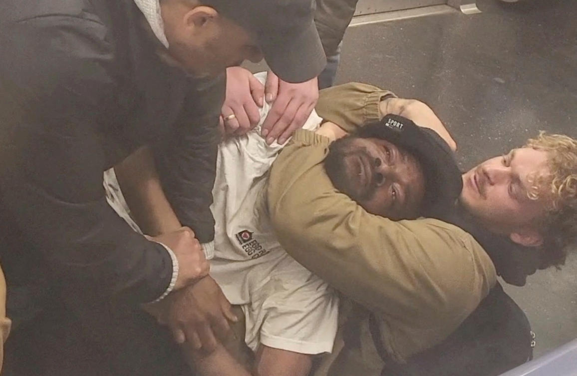 Above, a man later identified as Jordan Neely is placed in a choke hold on a subway train in New York City in this still image taken from a video on May 1, 2023. (Juan Alberto Vazquez via Reuters)