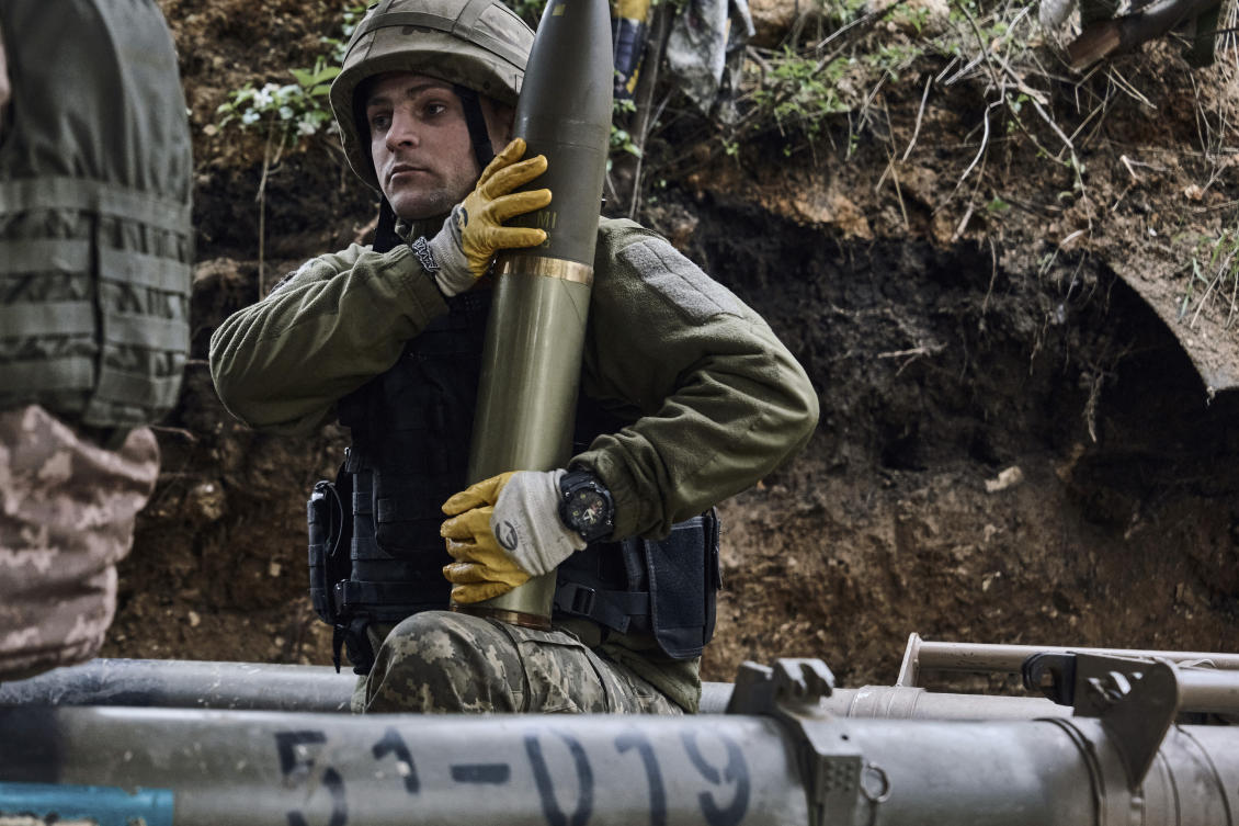 Ukrainian soldiers fire a cannon near Maryinka, an eastern city where fierce battles against Russian forces have been taking place, in the Donetsk region, on May 8, 2023. (AP)