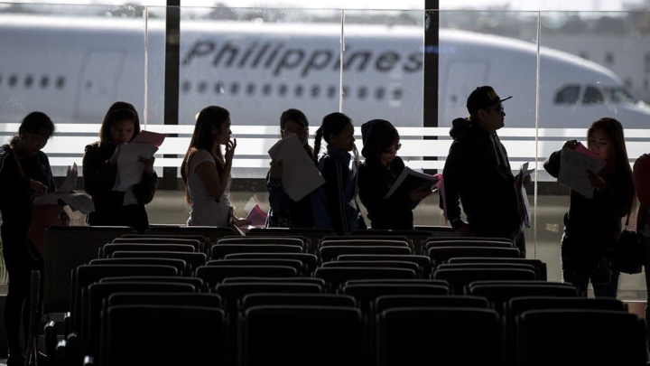 Philippine workers returning home from the Gulf arrive at Manila International Airport. (File/AFP)