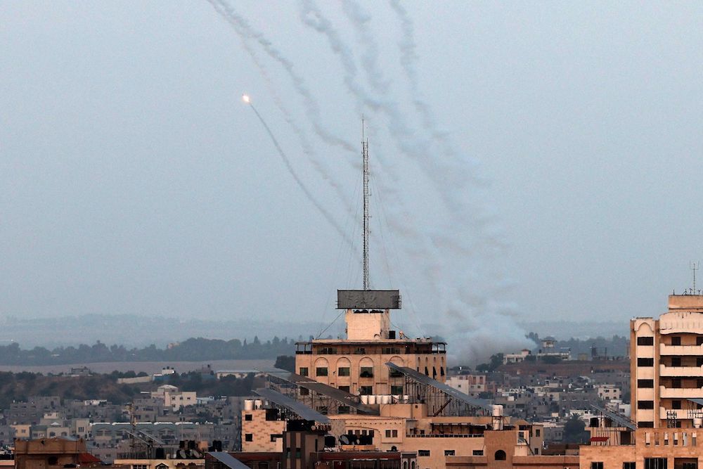 Rockets are fired from Gaza City towards Israel on May 13, 2023. Israeli air strikes battered Gaza again on May 13 in response to rocket fire from militants as deadly fighting resumed after a night of relative calm. (AFP)
