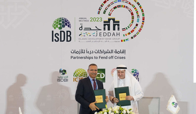 The signing of the Afghanistan Humanitarian Trust Fund included 7 humanitarian projects with IsDB, Jamal Al-Saati, special advisor to the president of IsDB right. (AN photo by Mohammed Khayat)
