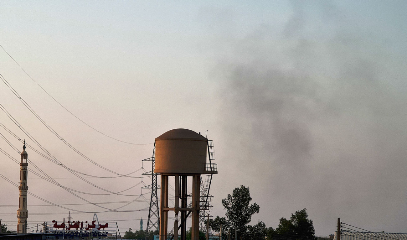 Smoke billows in the distance in war-torn Khartoum, on May 14, 2023. (AFP)