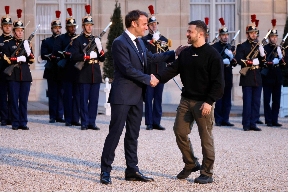 Ukraine's President Volodymyr Zelensky is welcomed by France's President Emmanuel Macron (left) upon his arrival at the Elysee presidential palace in Paris on May 14, 2023. (AFP)