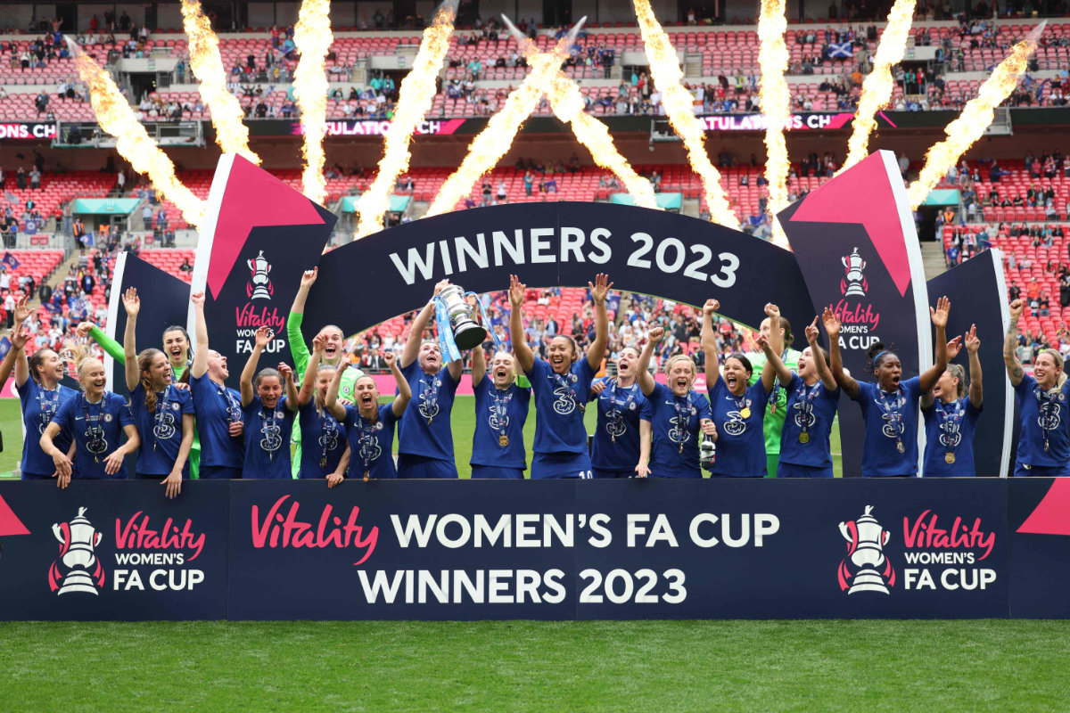 Chelsea players celebrate with the trophy after winning the English Women's FA Cup final against Manchester United at Wembley Stadium in London Sunday. (AFP)