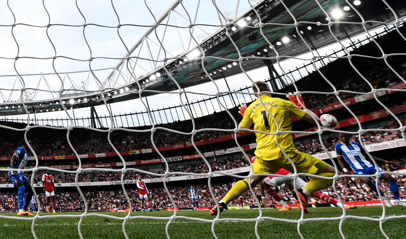 Brighton's Ecuadorian defender Pervis Estupinan (Rear R) shoots and scores his team third goal during the English Premier League football match between Arsenal and Brighton at the Emirates Stadium in London on Sunday. (AFP)