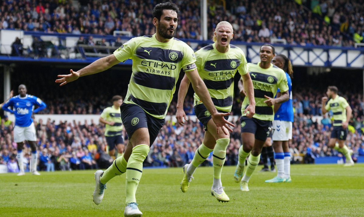 Manchester City's Ilkay Gundogan celebrates after scoring his side's opening goal during the English Premier League soccer match between Everton and Manchester City at the Goodison Park stadium in Liverpool, Sunday. (AP)