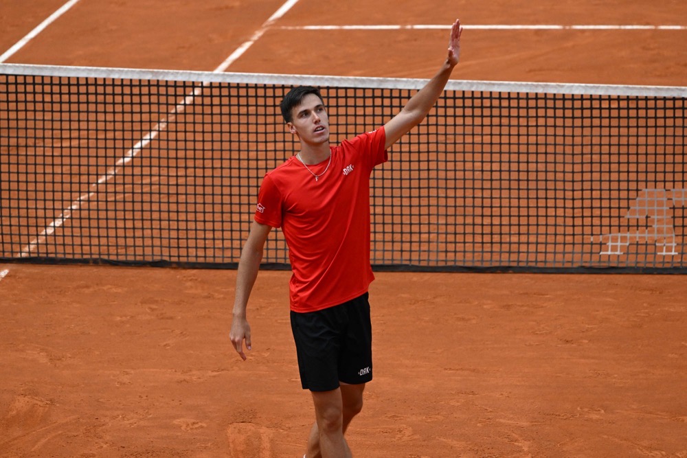 Hungary's Fabian Marozsan celebrates after defeating Spain's Carlos Alcaraz during their third round match of the Men's ATP Rome Open tennis tournament at Foro Italico in Rome on Monday. (AFP)