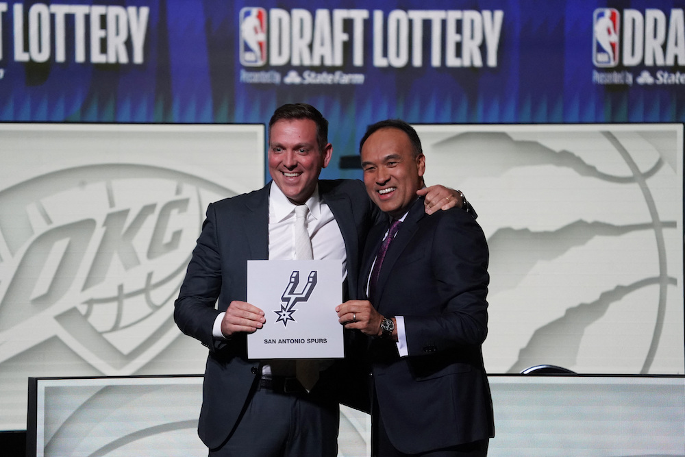 NBA Deputy Commissioner Mark Tatum, right, congratulates San Antonio Spurs managing partner Peter J. Holt for winning the first pick in the 2023 NBA Draft Lottery at McCormick Place West. (USA TODAY Sports)