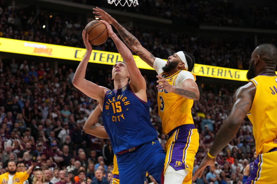 Denver Nuggets center Nikola Jokic shoots over Los Angeles Lakers forward Anthony Davis during the second half of Game 1 of the NBA basketball Western Conference Finals series in Denver. (AP)