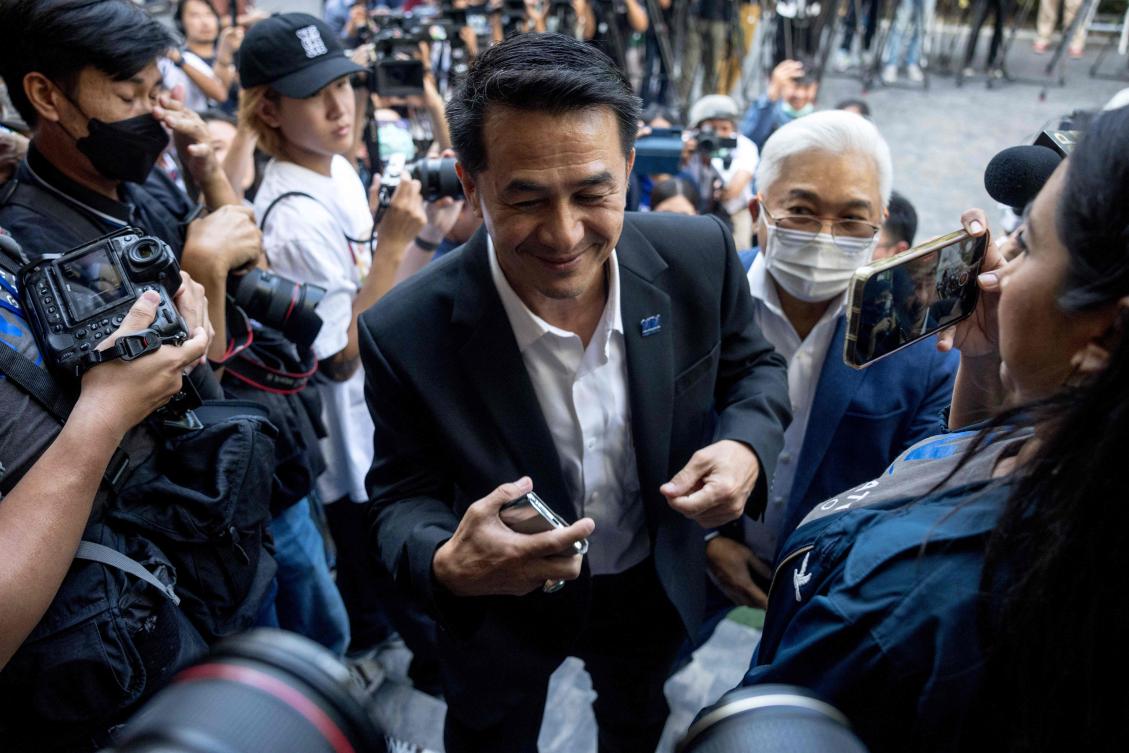 Above, Pheu Thai Party leader Chonlanan Srikaew arrives to meet with Move Forward Party leader and prime ministerial candidate Pita Limjaroenrat during potential coalition discussions in Bangkok on May 17, 2023. (AFP)
