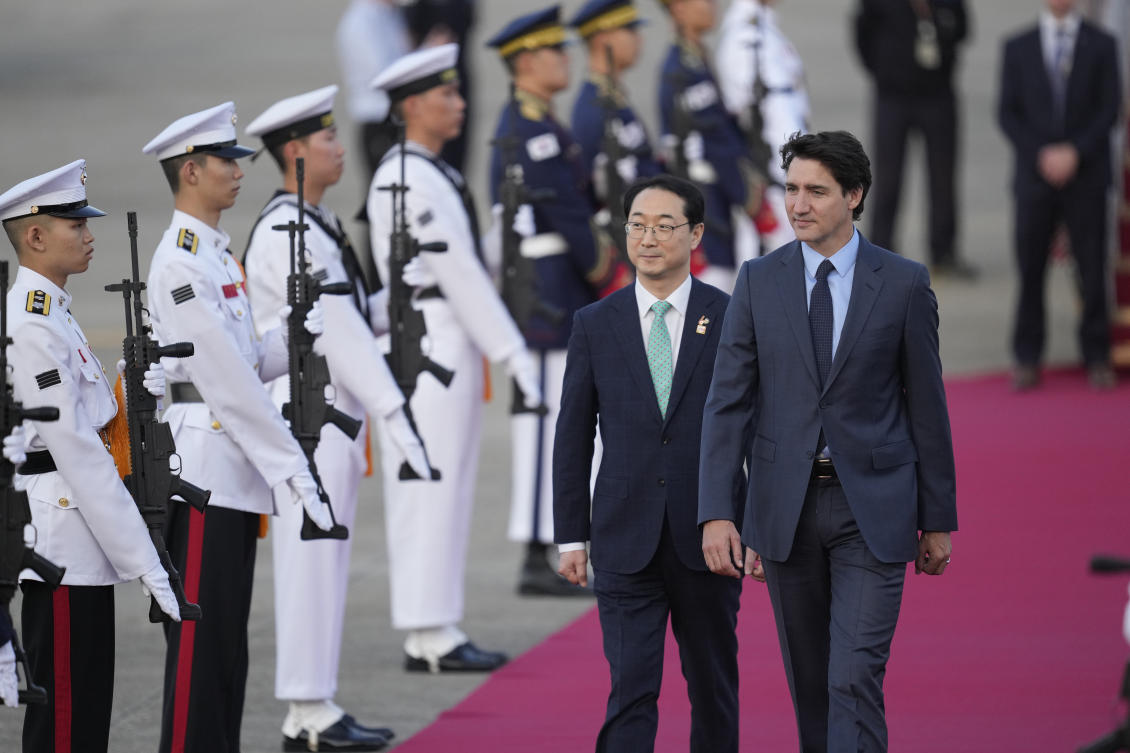 Canadian Prime Minister Justin Trudeau is escorted by South Korea’s Special Representative for Korean Peninsula Peace and Security Affairs Kim Gunn upon his arrival at the Seoul airport in Seongnam, South Korea on May 16, 2023. (AP)
