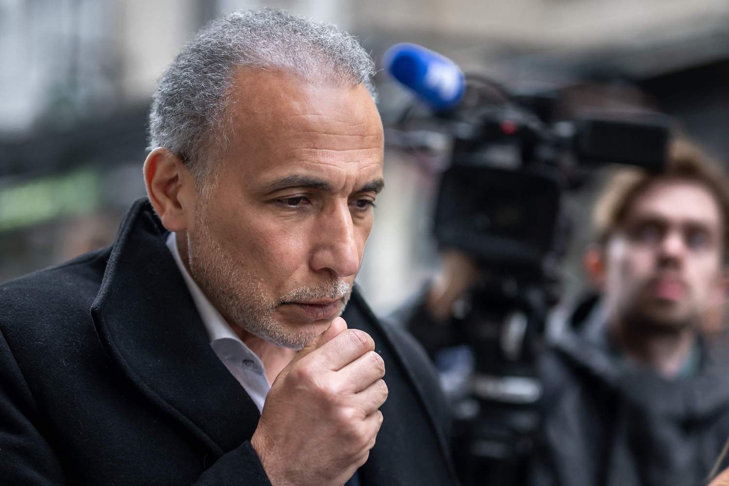 Swiss Islamic scholar Tariq Ramadan arrives on the second day of his trial at the Geneva court house on May 16, 2023. (AFP)