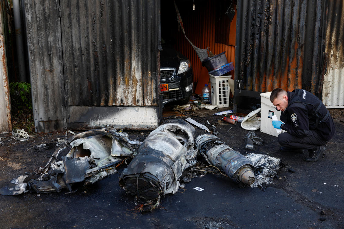 Police officer inspects remains of a Russian cruise missile shot down by Air Defence Forces, amid Russia's attack on Ukraine, in Kyiv (REUTERS)