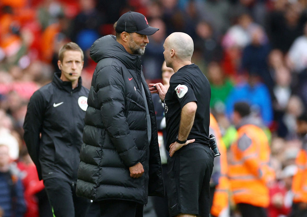 Referee Paul Tierney talks to Liverpool manager Juergen Klopp during their Premier League match against Tottenham Hotspur at Anfield, Liverpool on Apr. 30, 2023. (Reuters)