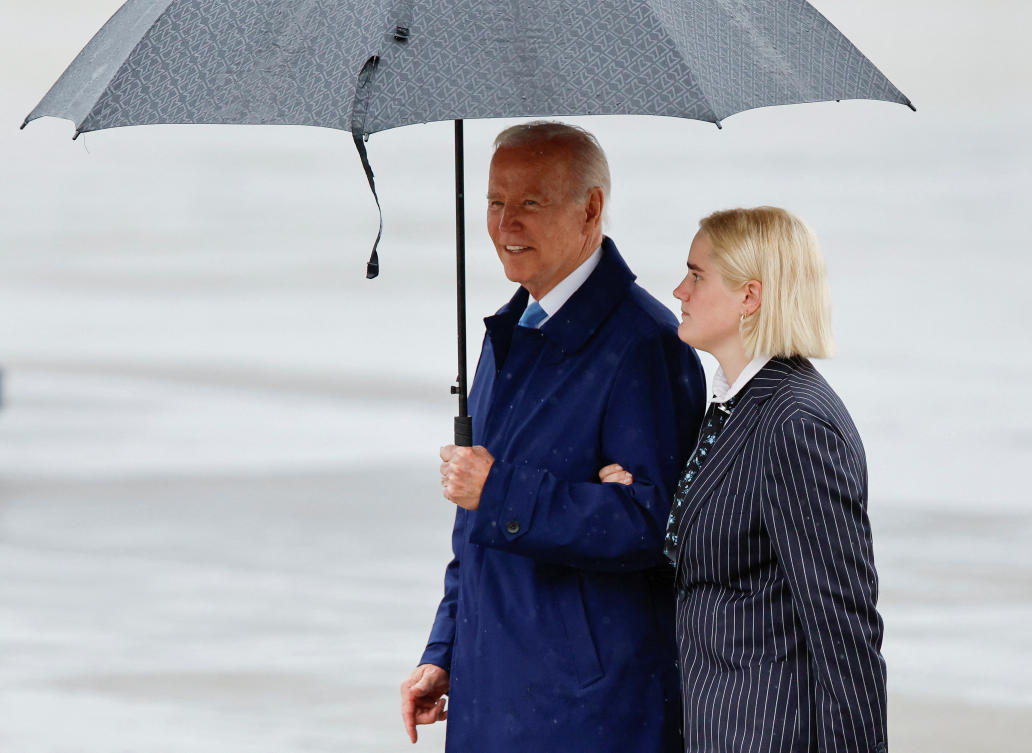 US President Joe Biden stands on the tarmac with his granddaughter Maisy Biden at U.S. Marine Corps Air Station Iwakuni, in Iwakuni, Japan. (Reuters)
