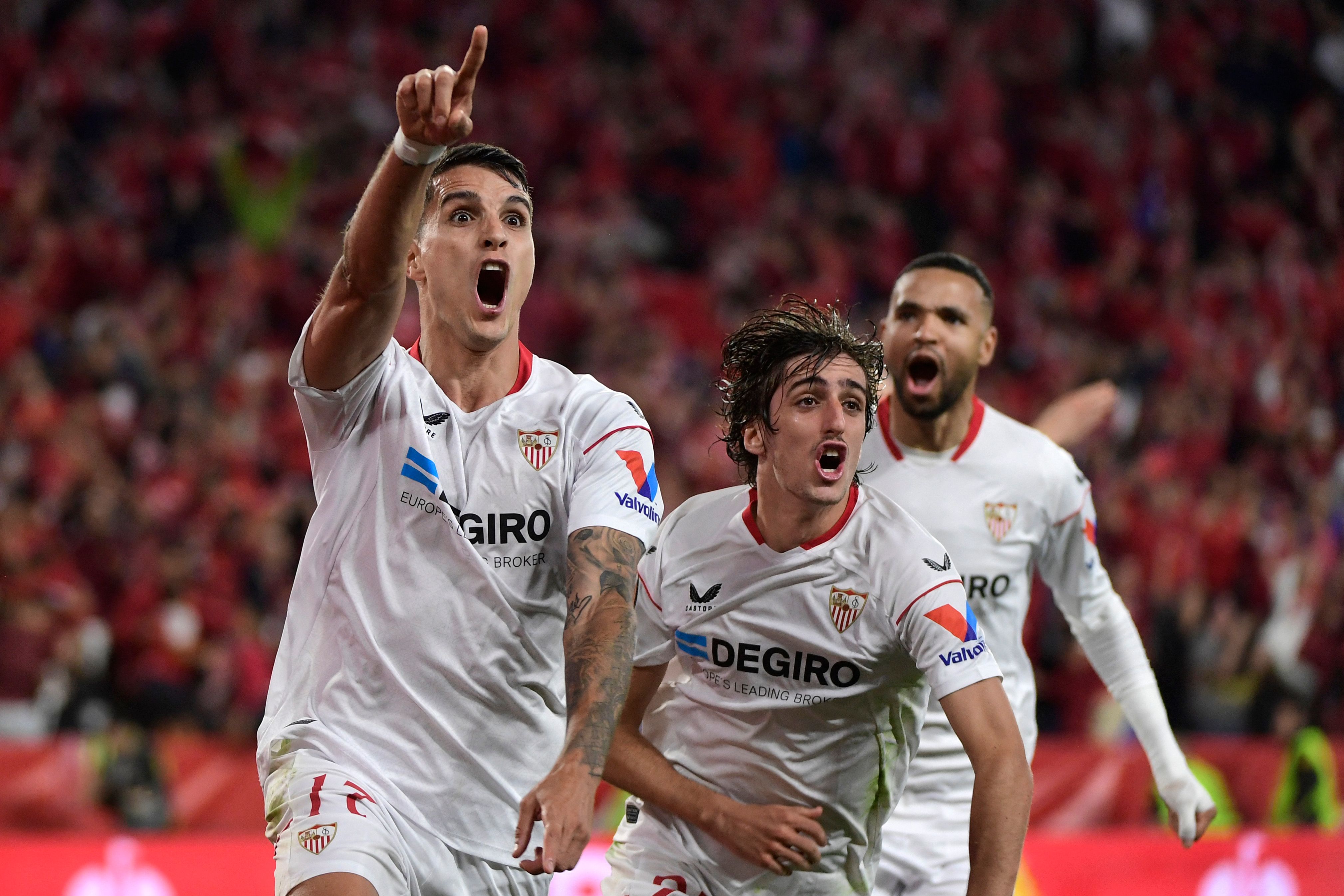 Sevilla's Argentinian forward Erik Lamela (L) celebrates scoring his team's second goal during the UEFA Europa League semifinal second leg football match between Sevilla FC and Juventus at the Ramon Sanchez Pizjuan stadium in Seville on Thursday. (AFP)