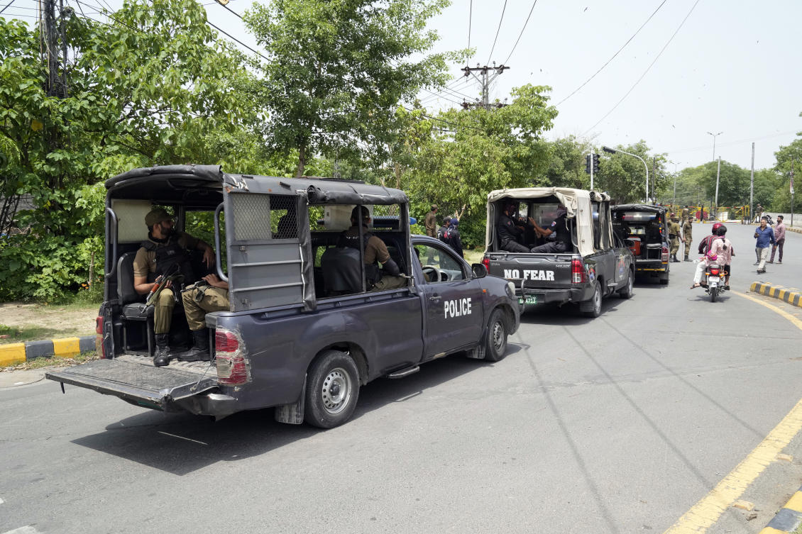 Police personnel patrol around the residence of Pakistan’s Imran Khan in Lahore as they keep up their siege around the home of the former prime minister. (AP)