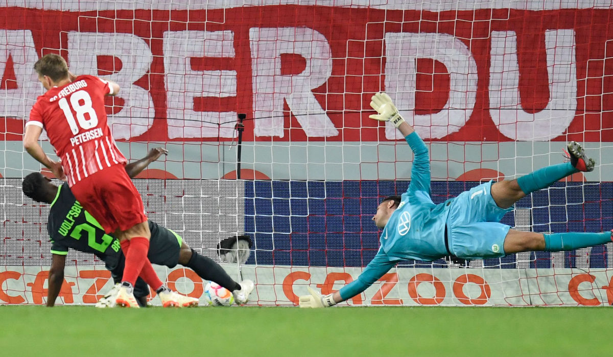 Freiburg's German forward Nils Petersen (L) scores during the German first division Bundesliga football match between SC Freiburg and VfL Wolfsburg in Freiburg on Friday. (AFP)
