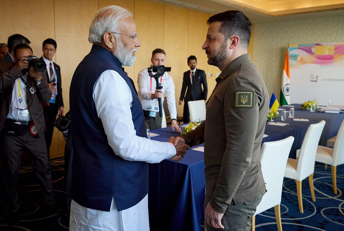 This handout photograph taken and released by the Ukrainian Presidential Press Service on May 20, 2023, shows Ukraine’s President Volodymyr Zelensky shaking hands with India’s Prime Minister Narendra Modi on the second day of the G7 Summit. (AFP)
