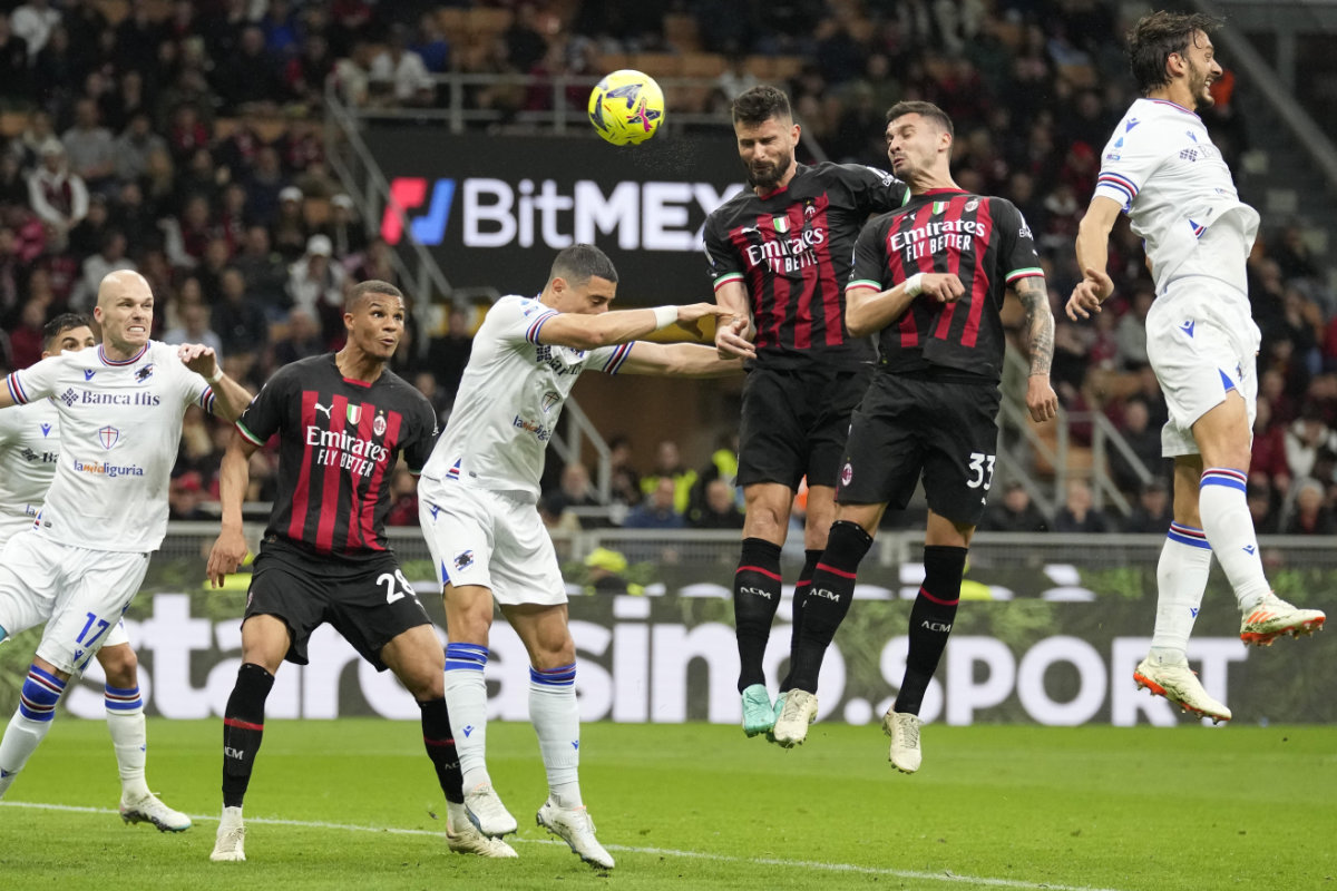 AC Milan's Olivier Giroud, third from right, heads the ball to score his side's second goal during a Serie A soccer match between AC Milan and Sampdoria , at the San Siro stadium in Milan Saturday. (AP)