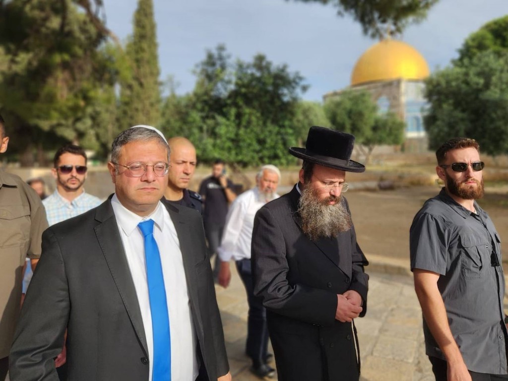 Israel's National Security Minister Itamar Ben-Gvir (L) walking through the courtyard of Jerusalem's Al-Aqsa mosque complex, known to Jews as the Temple Mount, early on May 21, 2023. (AFP)