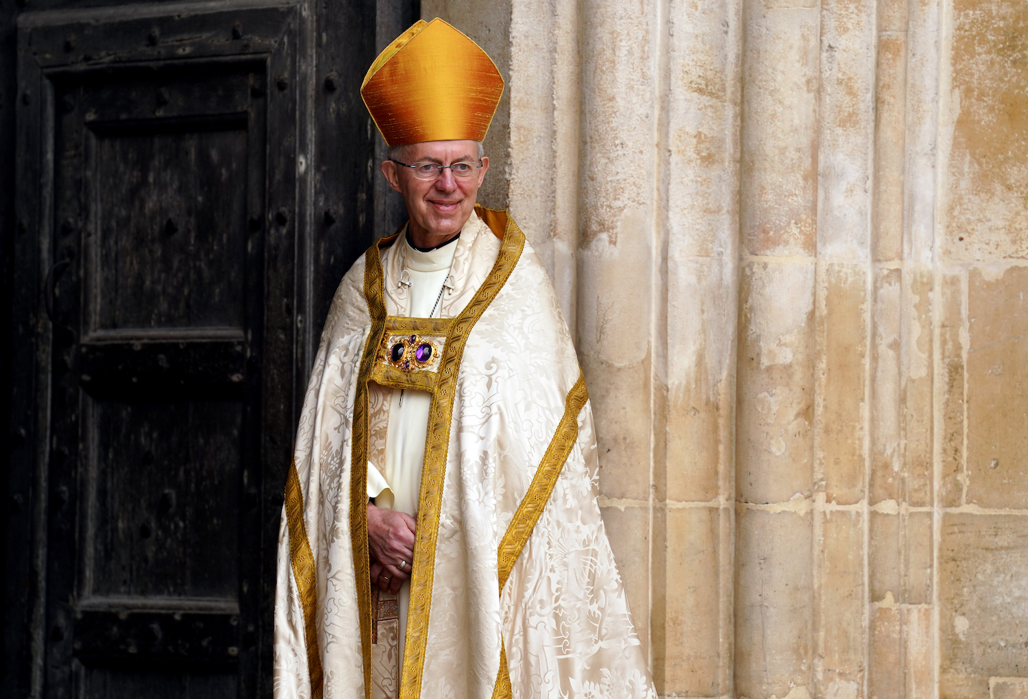 Archbishop of Canterbury Justin Welby smiles at Westminster Abbey in central London. (File/AFP)