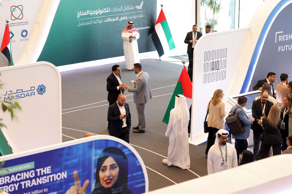Participants to the UAE Climate Tech Forum in Abu Dhabi are shown in this picture taken on May 10, 2023. Arab Gulf's energy giants are turning to humble tech start-ups as they search for ways to remove emissions while keeping oil flowing. (AFP)