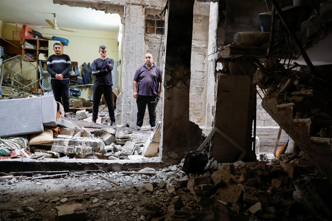 Palestinians check a house damaged during an Israeli raid, in Balata camp, Nablus, in the Israeli-occupied West Bank. (Reuters)