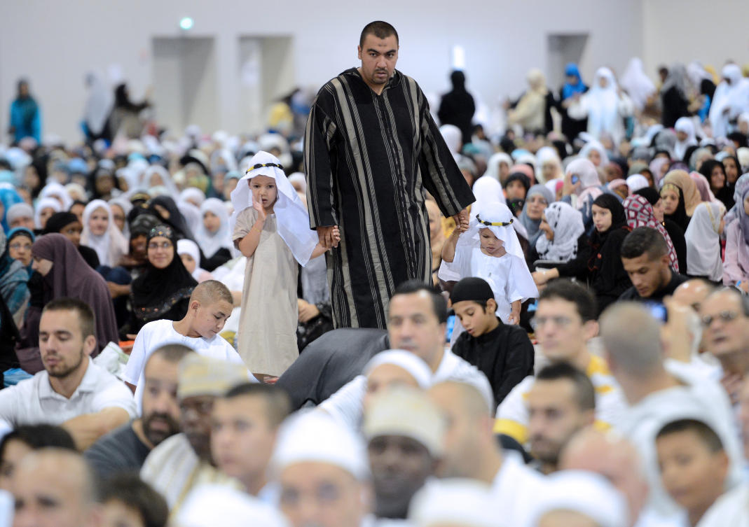 French Muslims listen to a sermon before the Eid Al-Fitr prayer in the Parc Chanot in Marseille, southeastern France. (File/AFP)