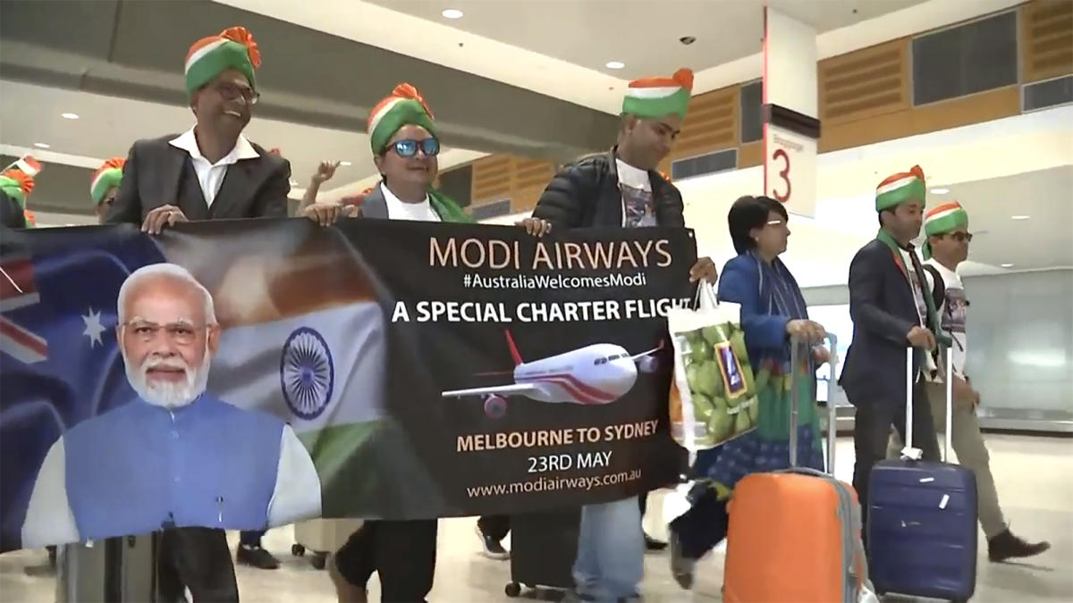 Festivities in Sydney have already begun outside the venue with supporters breaking into orchestrated dances praising Modi. (Australian Broadcasting Corp)