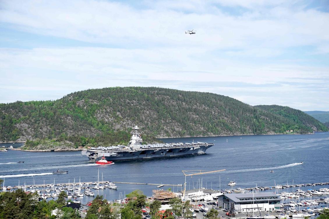 Above, the USS Gerald R. Ford aircraft carrier on its way into the Oslo Fjord in Norway on May 24, 2023. (NTB/AFP)