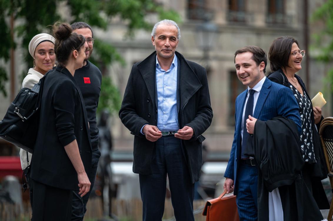 Swiss leading Islamic scholar Tariq Ramadan (C) reacts next to his lawyers Theo Badan and Yael Hayat as he leaves Geneva on May 24, 2023, after he was acquitted at the end of his trial for “rape and sexual coercion” in a case dating back 15 years. (AFP)