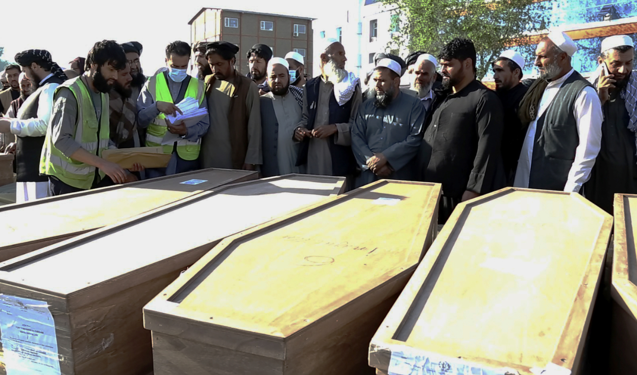 Afghan families receive bodies of their relatives who died while being smuggled into Bulgaria, at the Kabul International Airport in Kabul, Afghanistan, Wednesday, May 24, 2023. (AP)
