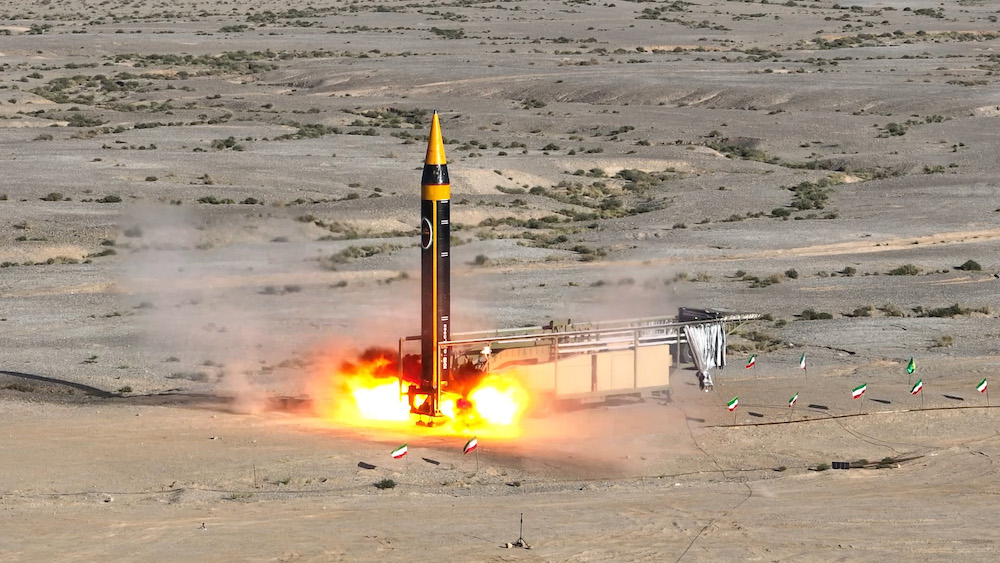 Above, the latest Khorramshahr ballistic missile, named Khaibar, launches at an undisclosed location in this photo provided by Iran’s defense ministry on May 25, 2023. (Iranian defense ministry/AFP)