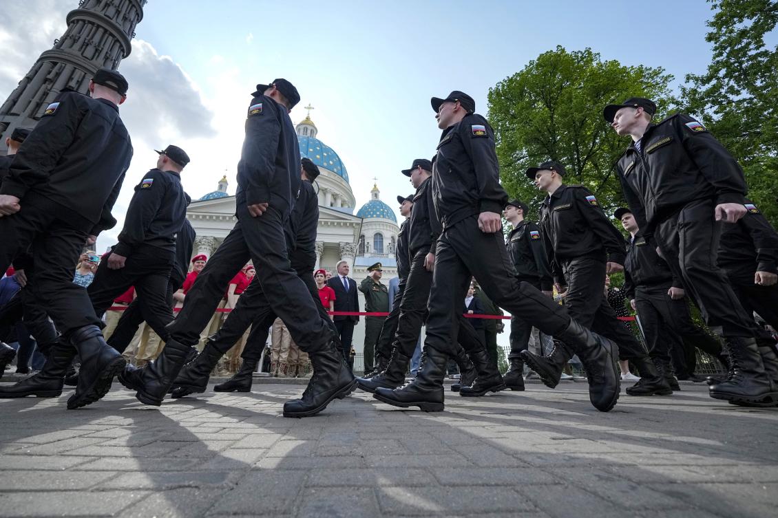 Japan’s latest sanctions targeted the Russian military as well as the construction and engineering sectors. Above, Russian conscripts march during a send-off event before they head to assigned military units for mandatory one-year military service. (AP)