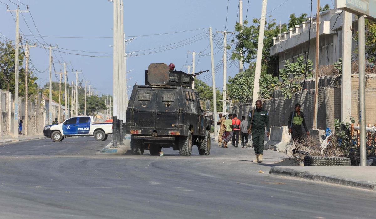 Security forces patrol outside a building which was attacked by suspected Al Shabaab militants in the Somalia's capital Mogadishu, on February 21, 2023. (AFP)